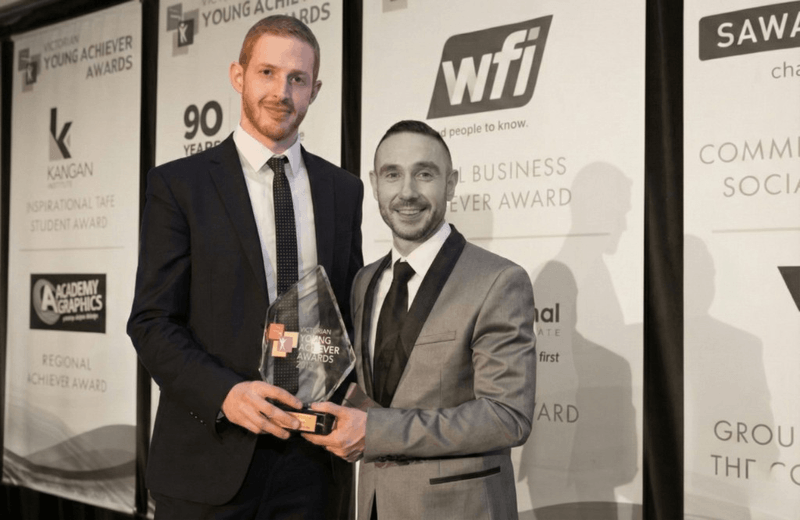 Max Hertan receiving the Young Achiever Business Award